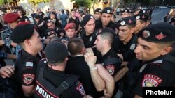 A scuffle between police officers and members of the Crusaders group protesting in Republic Square, Yerevan, August 8, 2023.