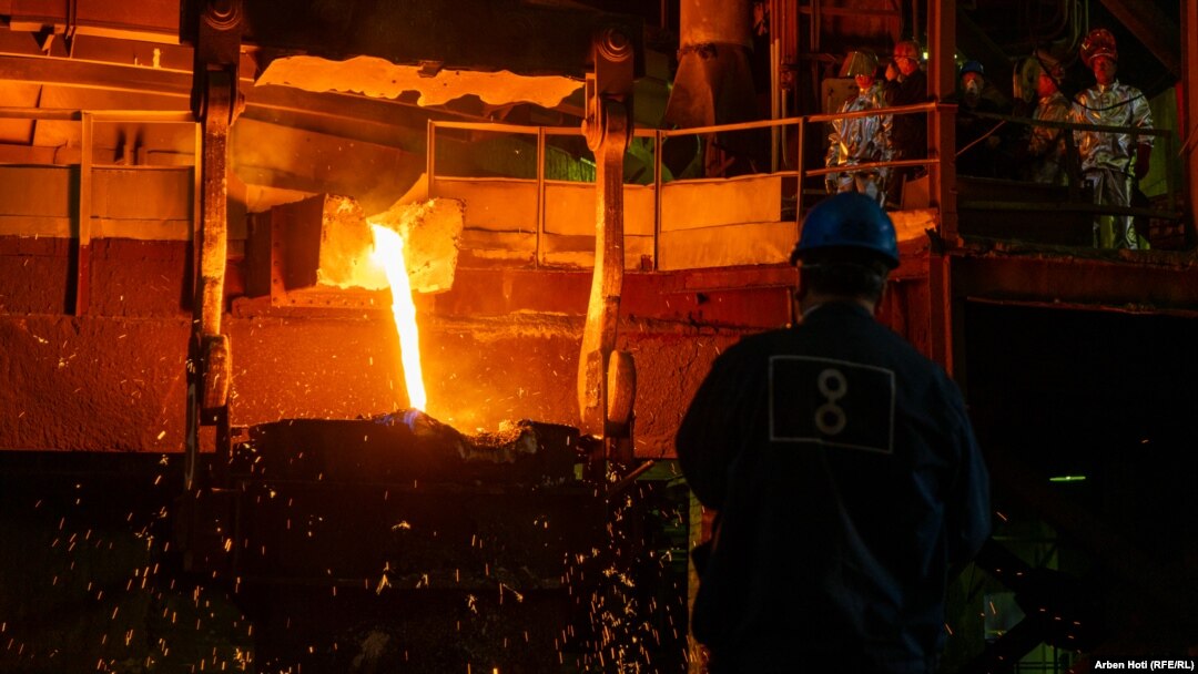 Newco Ferronikeli worker Sylejman Hajdari (right) watches nickel being processed.