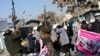 Taliban fighters fire in the air to break up a protest by women in Kabul. The number of women who are being held by the Taliban is unknown. (file photo)