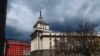 Сградата на бившия Партиен дом на ЦК на БКП в София. По време на социализма на мястото на българското знаме е имало червена петолъчка.