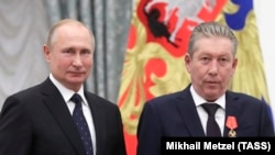 Президент Росії Володимир Путін та голова ради директорів російської нафтової компанії «Лукойл» Равіль Маганов, архівне фото 