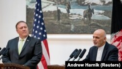 Afghan President Ashraf Ghani (right) and Secretary of State Mike Pompeo during a news conference at the Presidential Palace in Kabul in July.