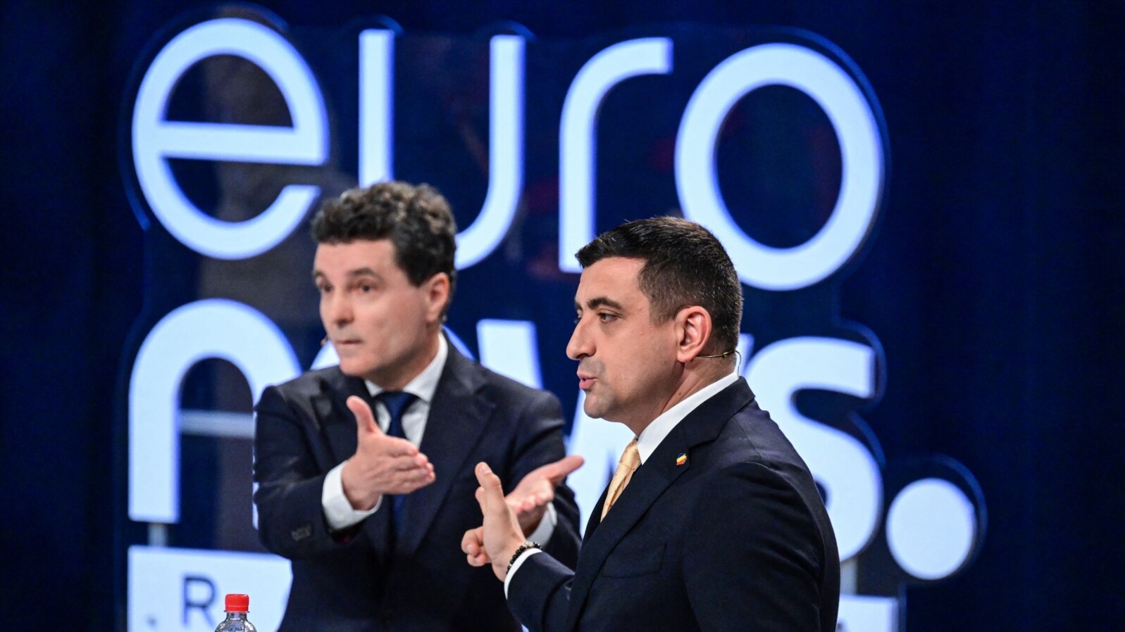 Presidential candidates George Simion (R) and Nicusor Dan (L) take part in a debate organized by Euronews Romania in Bucharest May 8, 2025.