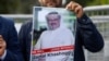 FILE: A demonstrator holds the picture of Saudi journalist Jamal Khashoggi during a protest in front of Saudi Arabia's consulate in Istanbul (October).