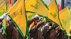 رژۀ نظامی نیروهای حزب‌الله در تشییع جنازۀ اسماعیل باز، از فرماندهان ارشد این گروه شبه‌نظامی که در حملۀ پهپادی اسرائیل در جنوب لبنان کشته شد