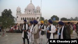 FILE: Indian Sikh pilgrims visit Gurdwara Darbar Sahib, the shrine of their spiritual leader Guru Nanak Dev in Kartarpur.
