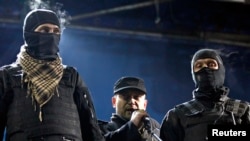 Yarosh (center) speaking in Kyiv on February 21.