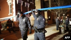 US -- NEW YORCity police officers were killed execution style Saturday afternoon as they sat in their marked police car on a Brooklyn street corner > on December 20, 2014 in New York City. Th