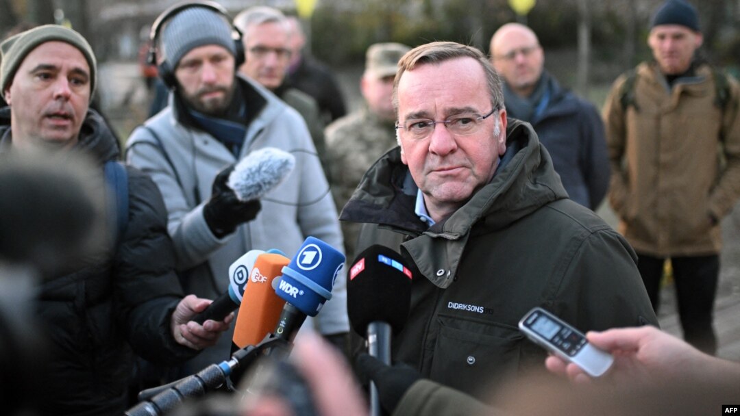 German Defense Minister Boris Pistorius speaks to reporters after laying flowers at a memorial on Maidan Nezalezhnosti, or Independence Square, in Kyiv on November 21.