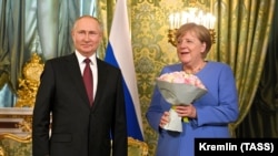 Володимир Путін і Ангела Меркель