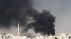 Syria -- Smoke rises from the eastern Damascus suburbs of Arbeen, after what activists say was an airstrike by a MIG fighter jet, 08Nov2012