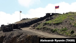 Azerbaijani (L) and Armenian army posts on the border between the two states, June 18, 2021.
