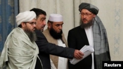 Members of the Taliban delegation take their seats during multilateral peace talks on Afghanistan in Moscow in November 2018.