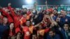 Cricket players of Islamabad United celebrate their victory in the final of the Pakistan Super League in 2018.