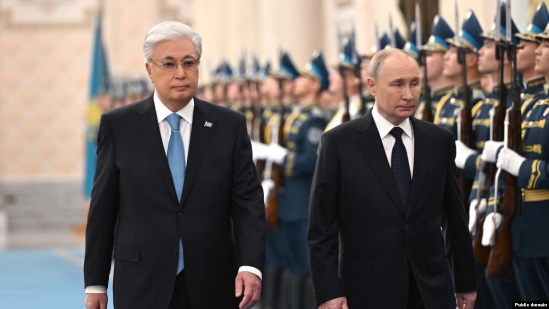 Kazakh President Qasym-Zhomart Toqaev and Russian President Vladimir Putin review troops after Putin arrived for a state visit on November 27.