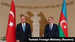 AZERBAIJAN -- Turkish Foreign Minister Mevlut Cavusoglu (left) meets with his Azeri counterpart Ceyhun Bayramov in Baku, November 1, 2020