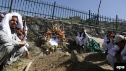 Afghan relatives attend a funeral for Afghan interpreter Zabihullah Tamanna in Kabul in June 2016.