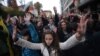 Students held up their hands to protest what they regarded as police violence during an antigovernment protest in downtown Sofia on November 13. 