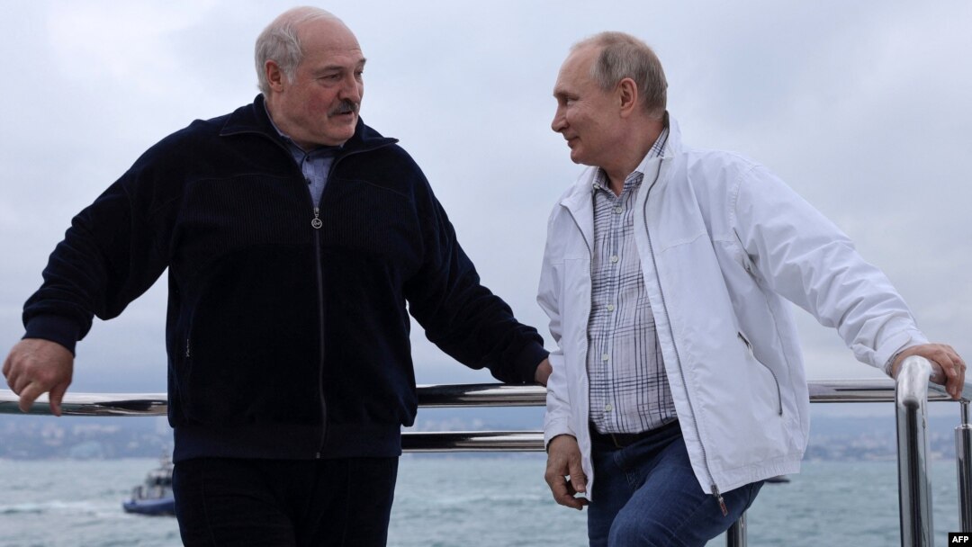 Pushing ahead with crackdowns: Russian President Vladimir Putin (right) and Belarusian leader Alyaksandr Lukashenka on the Black Sea on May 29.