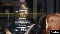A McDonald's employee Simferopol signals that the site is closed for business.