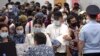 Uzbek migrant workers wait to check in for a flight to Tashkent at Tolmachevo Airport near Novosibirsk in 2020. Oson and Pay Way handle a large amount of remittances from Uzbeks living in Russia.