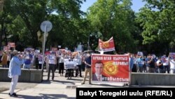 Protesters gather near the parliament building demanding Orhan Inan be found on June 3.