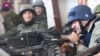 Російський актор Михайло Пореченков стріляє з кулемета в бік Донецького аеропорту, 30 жовтня 