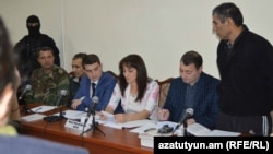 Nagorno Karabakh - Shahbaz Quliyev (R) and Dilgam Askerov (third from left), Azerbaijani men charged by Karabakh's authorities with sabotage, stand trial in Stepanakert, 27Oct2014.