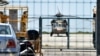 A Turkish military helicopter lands in the northern Greek city of Alexandroupolis with eight men on board who have requested political asylum after the attempted coup in Turkey, July 16, 2016. 