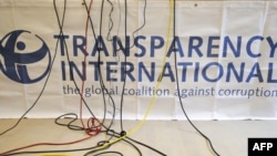Germany -- Microphone cables dangle over a logo of Transparency International (TI) during a press conference in Berlin, 23Sep2008