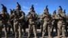 Молдовські солдати біля військових машин, отриманих Сполученими Штатами, на церемонії в Кишиневі