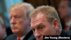 U.S. President Donald Trump, left, sits next to Acting U.S. Defense Secretary Patrick Shanahan during a Cabinet meeting at the White House on January 2.