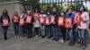 Родственники украинцев, находящихся в российских тюрьмах, с портретами своих родных
